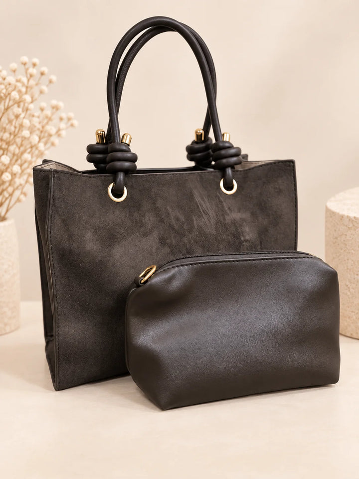 Bolsa Icon preta em camurça com asas de nó e bolsa necessaire
