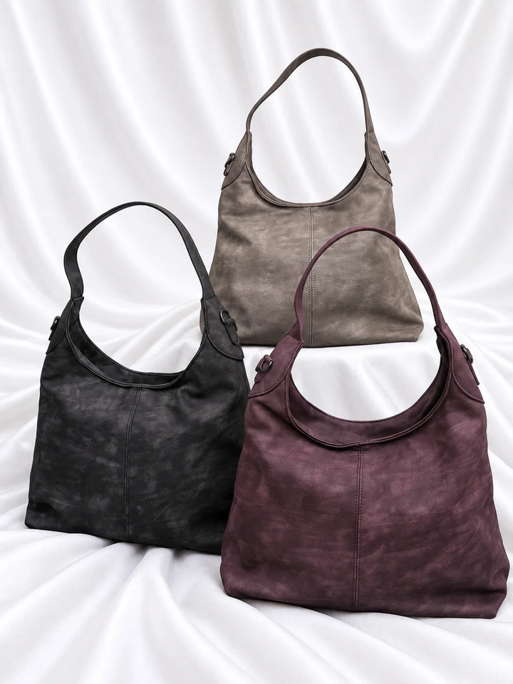 Bolsas Urban nas cores taupe, preto e roxo